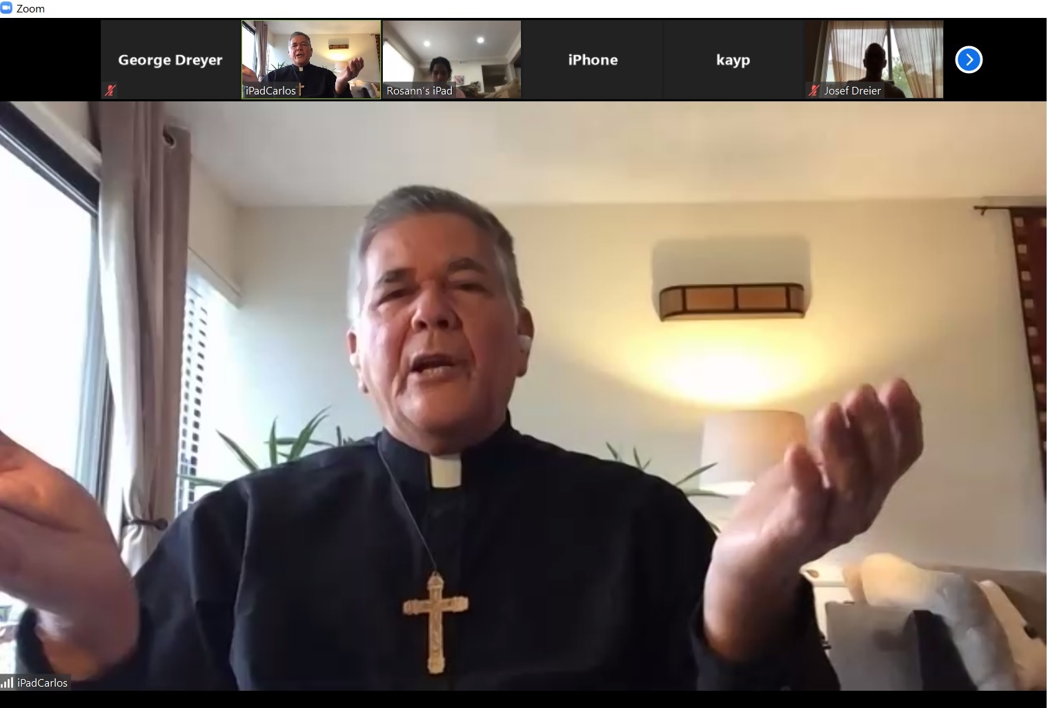 Father Carlos preaching at streamed service on Zoom